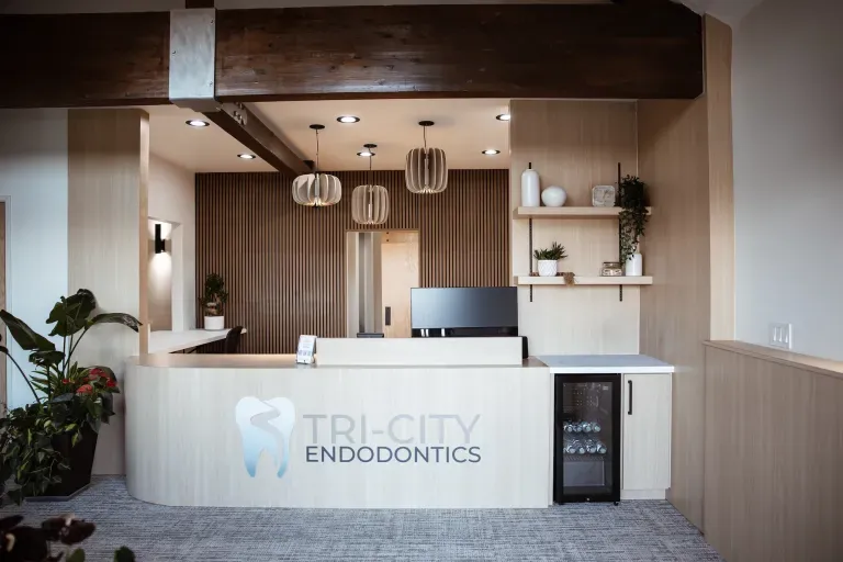 Tri-City Endodontics reception area with branded front desk